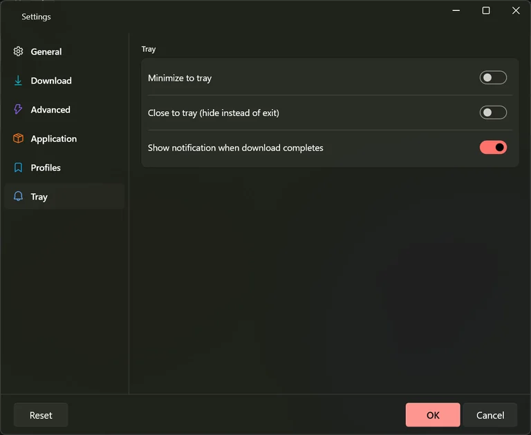 The Tray tab of Settings with switches for minimising to the notification area, closing to it, and showing a notification when a download completes.